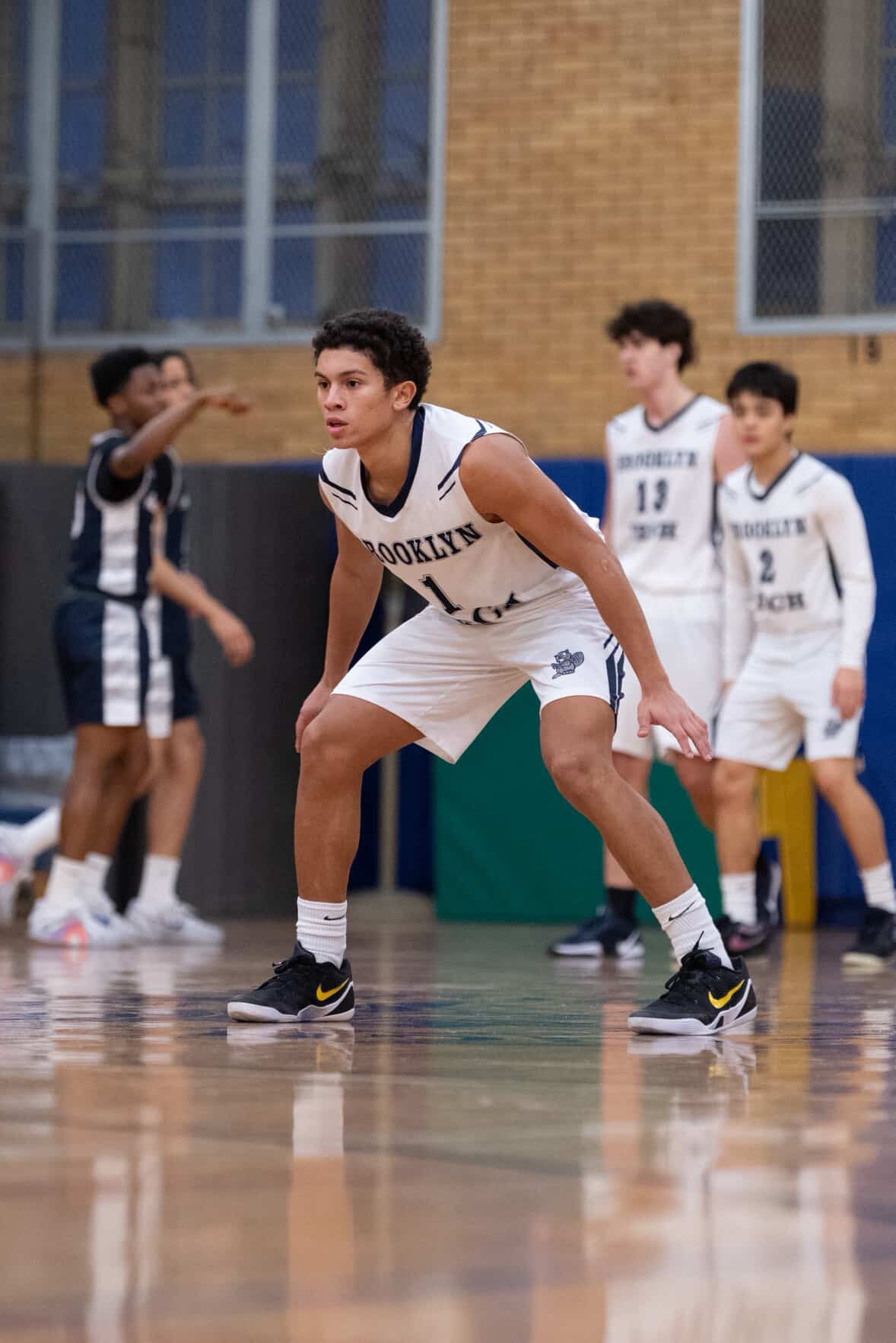 Tavious Scott defending during a Brooklyn Tech basketball game